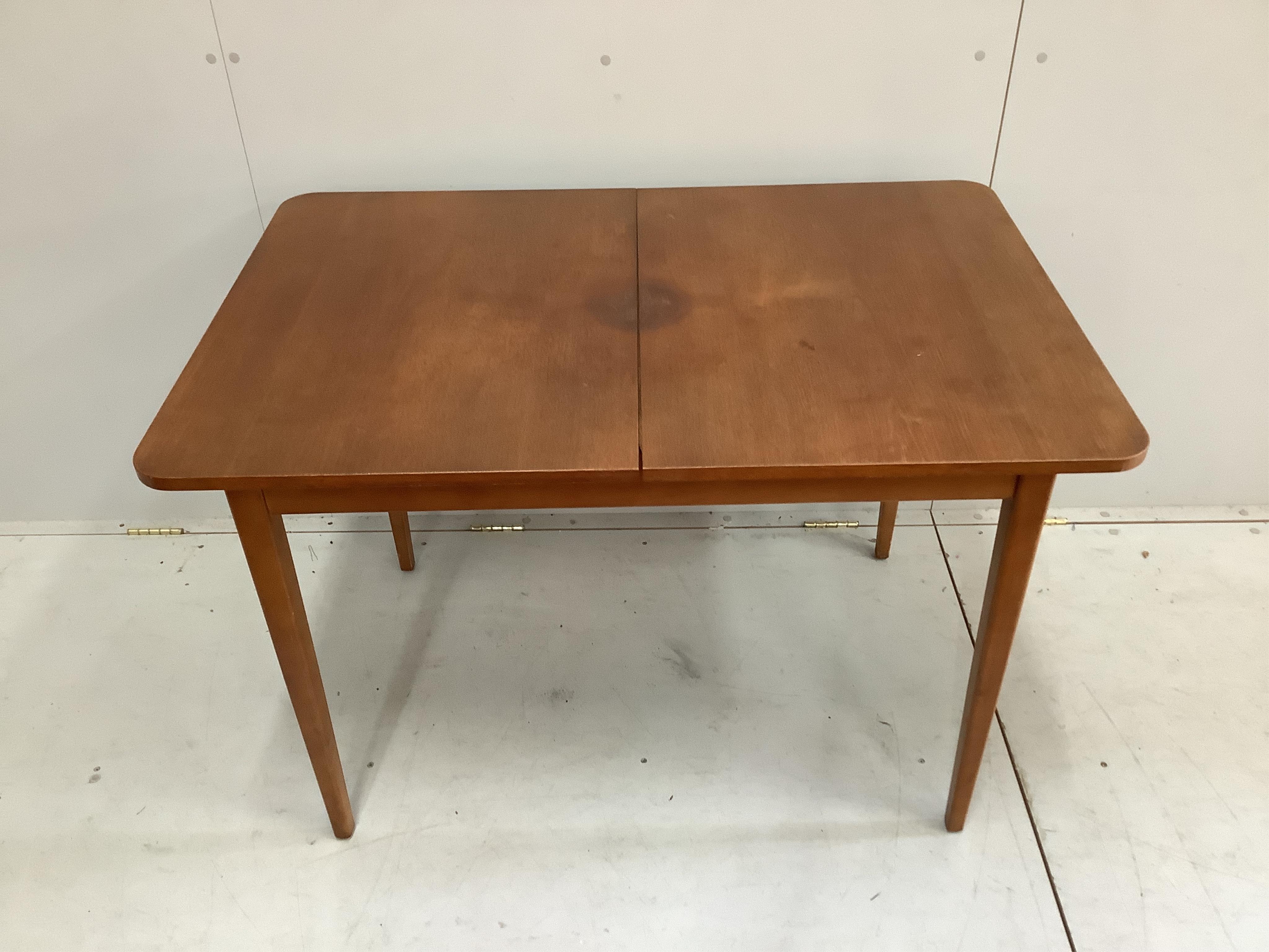 A mid century teak dining table and a set of four chairs. Condition - fair